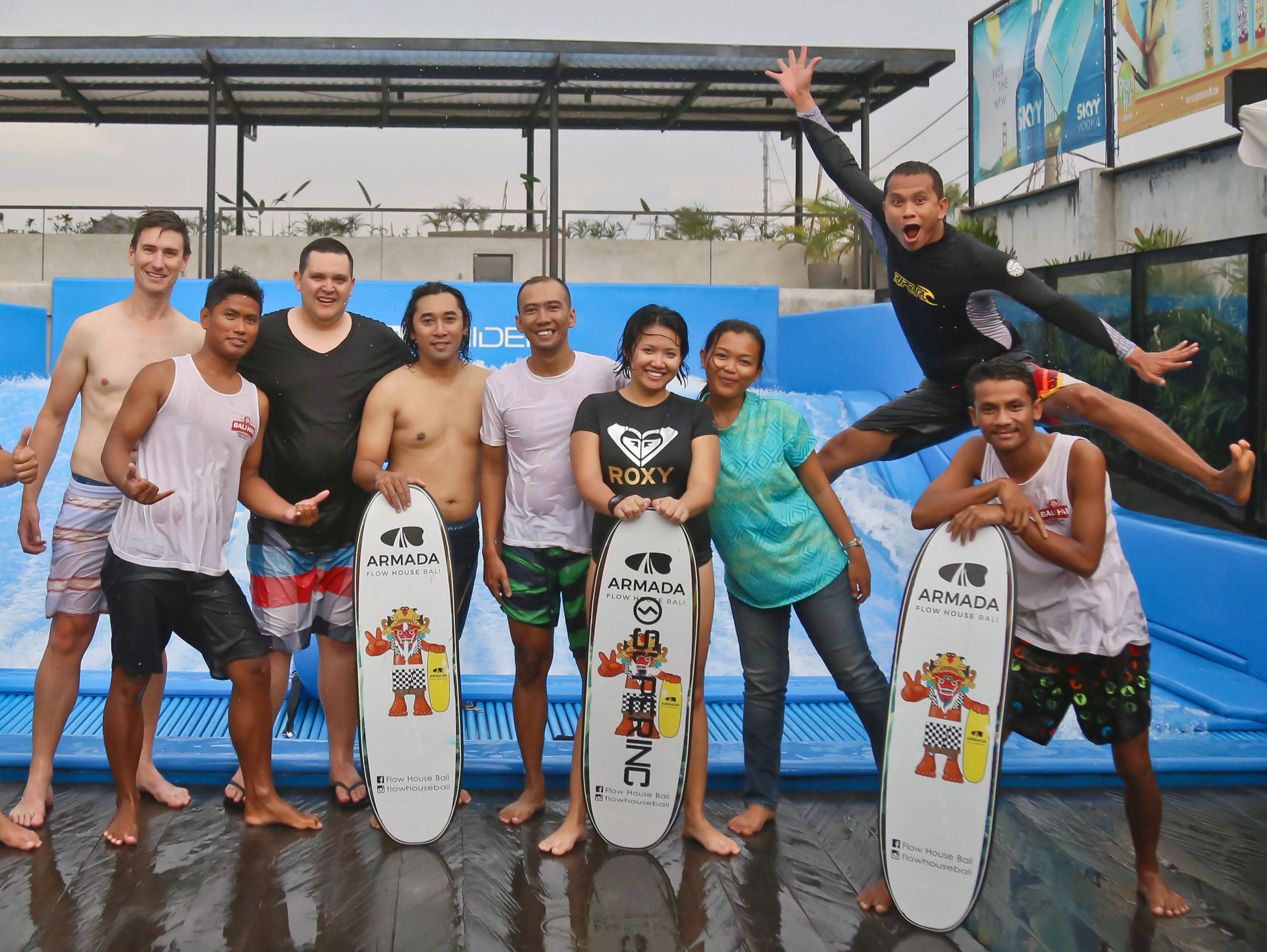 Team photo in front of the Armada Flow House surf ramp