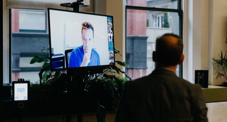 Remote worker on video screen