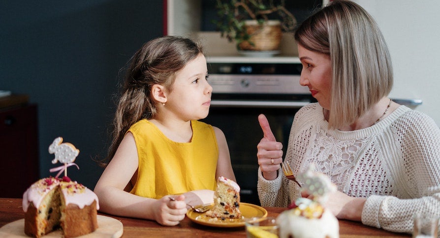 Mother and child with cake