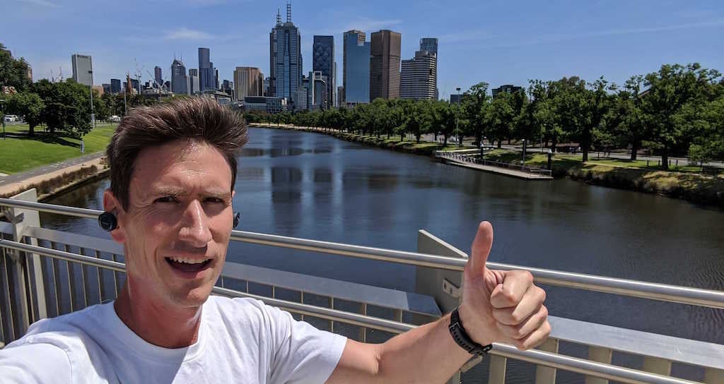 Andy on his run with Melbourne CBD in background