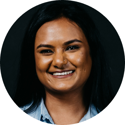 Picture of Renu Gudlawar against a black background