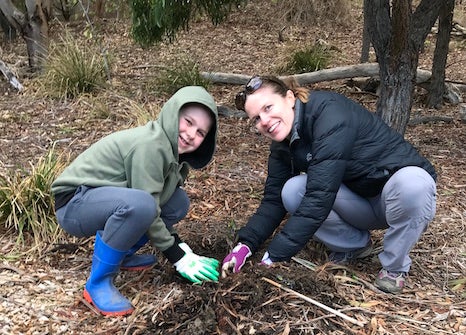 Tami and Lachie planting trees