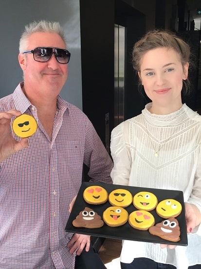 Kate and Jase with Emoji Cookies for World Emoji Day