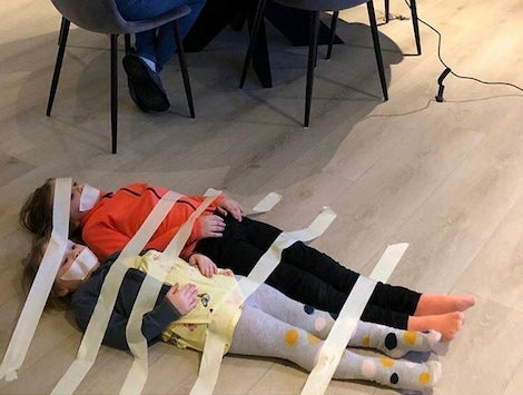 Kids masking taped to the floor