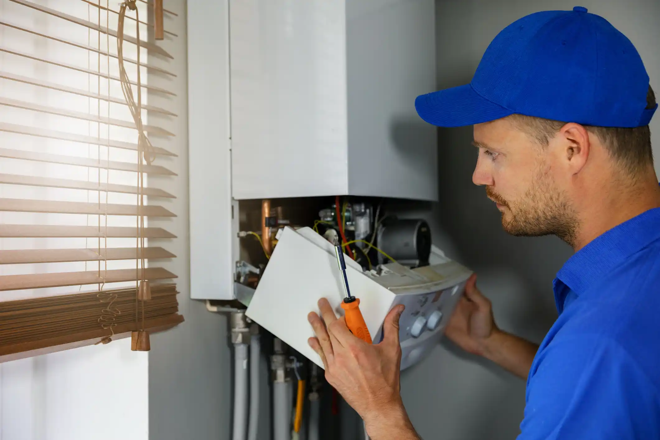 Engineer fixing boiler 