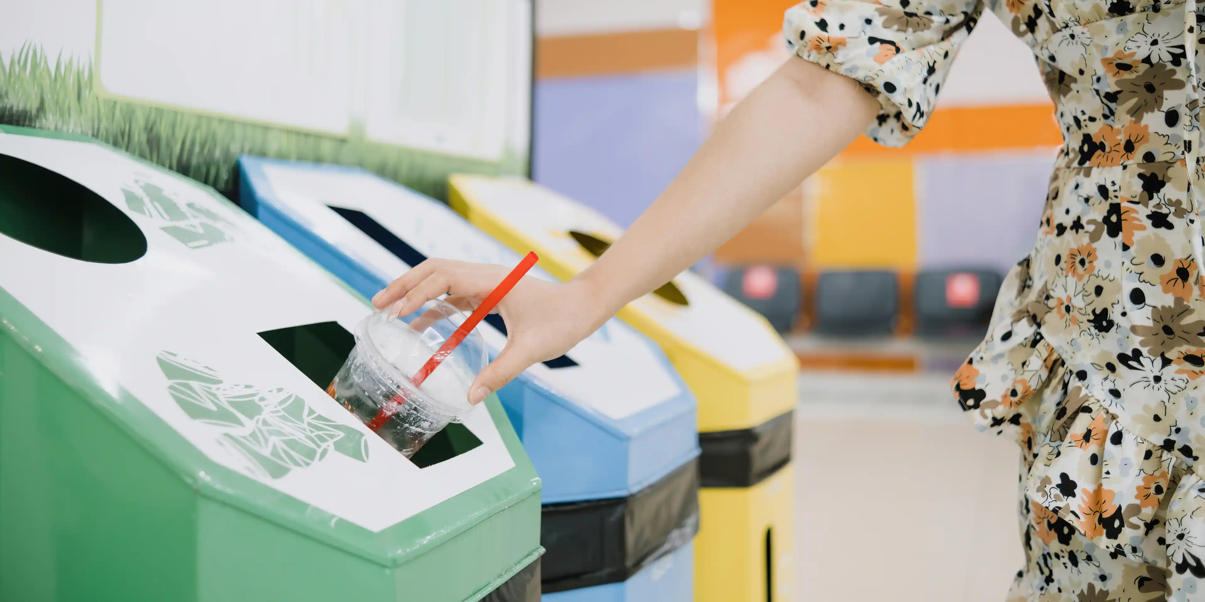 A lady leading by example by recycling her plastic