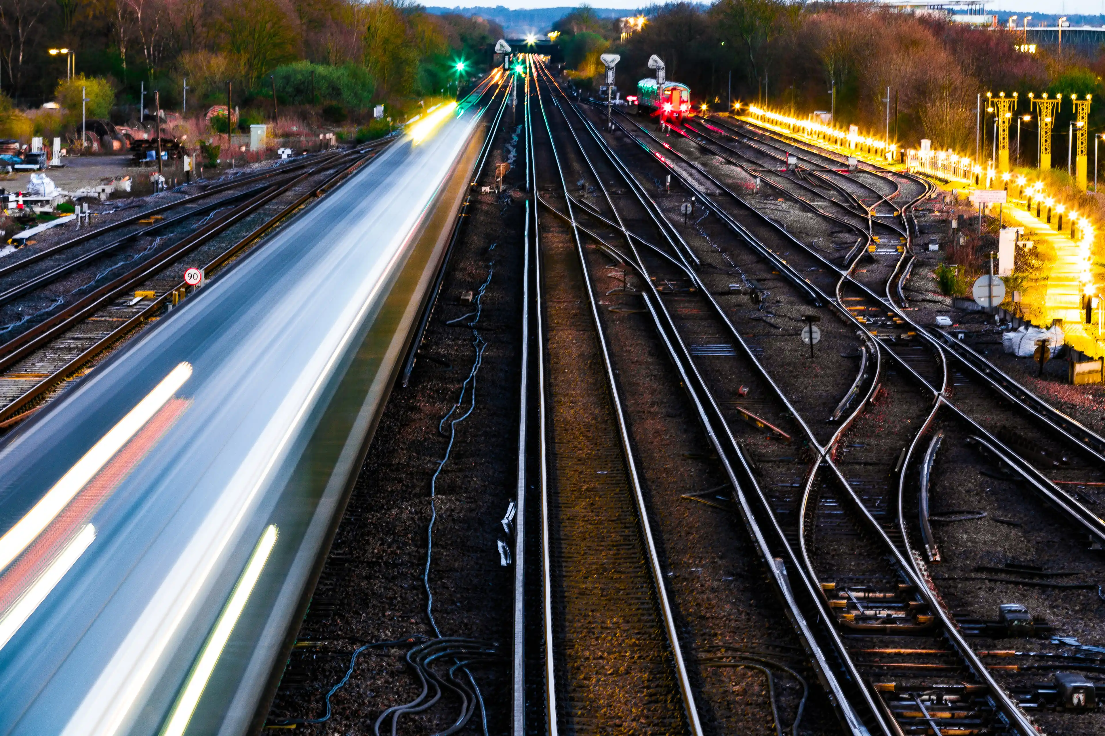 Railway lines with a train speeding past