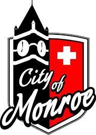 Logo for City of Monroe - a shield with a clock tower and text "city of monroe" across it