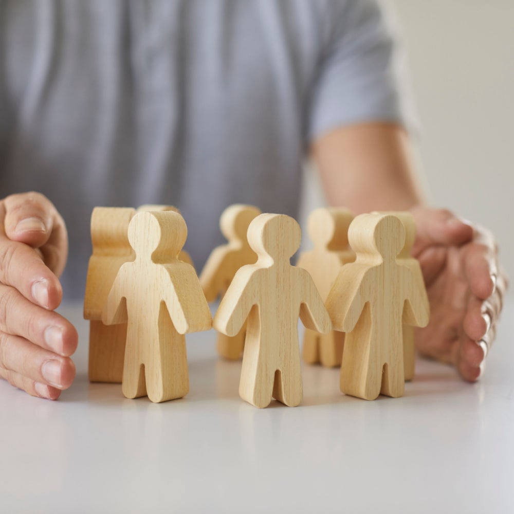 Hands with wooden people