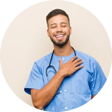 Male nurse laughing while holding his stethoscope