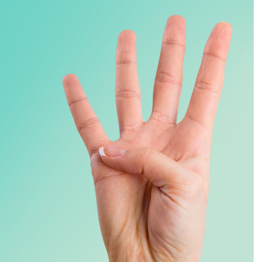 Person holding 4 fingers