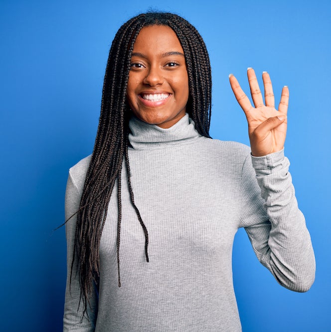 Woman holding up 4 fingers