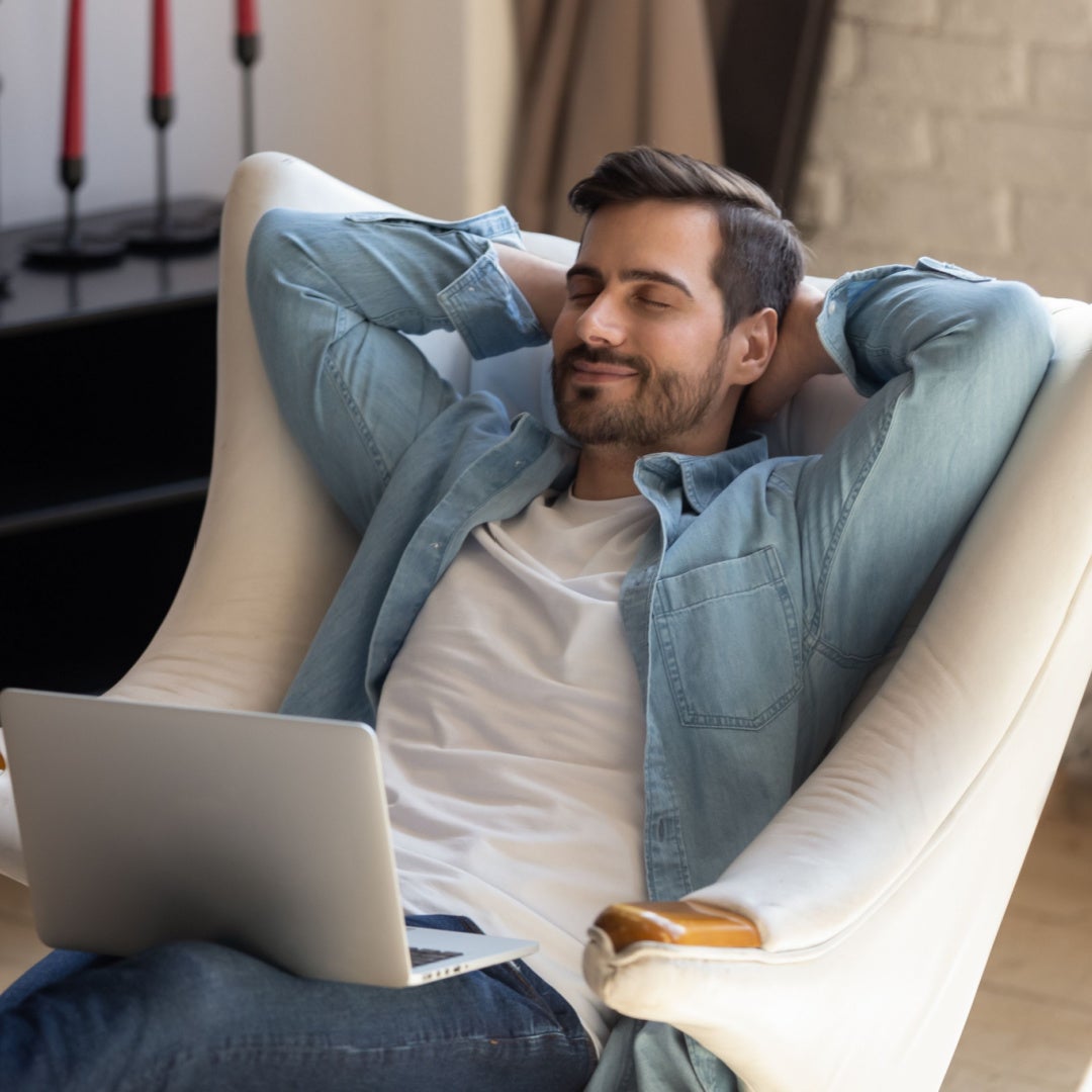 Man relaxing with laptop