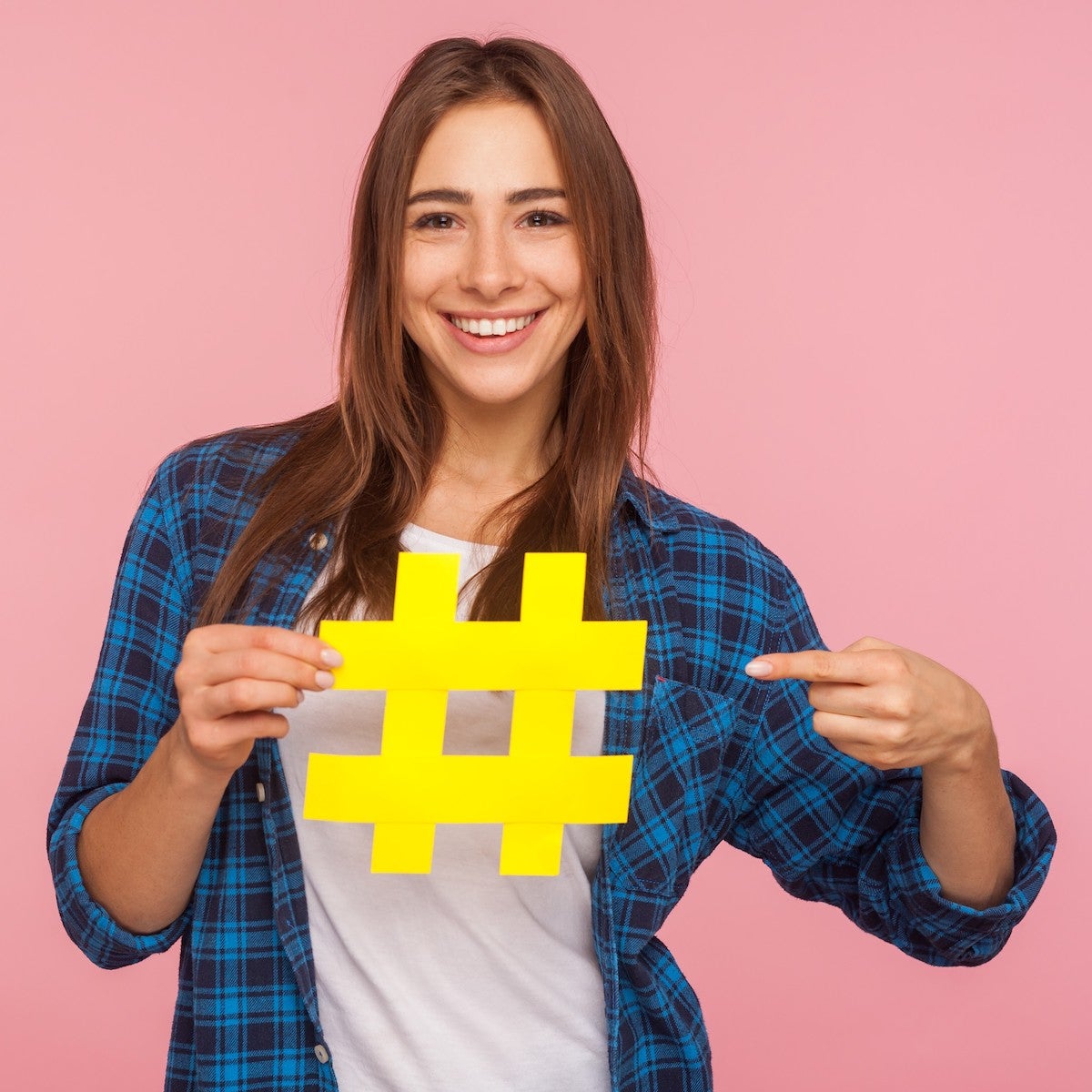 Woman holding hashtag