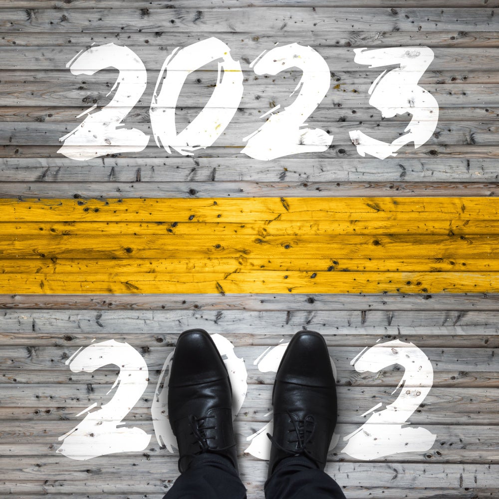 Man stepping on the word 2022