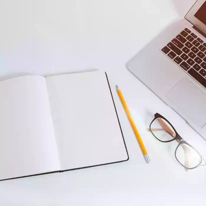 Photo of notebook and laptop