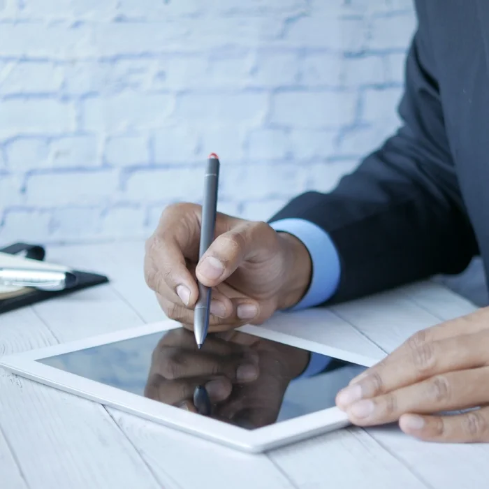 Image of man working on tablet