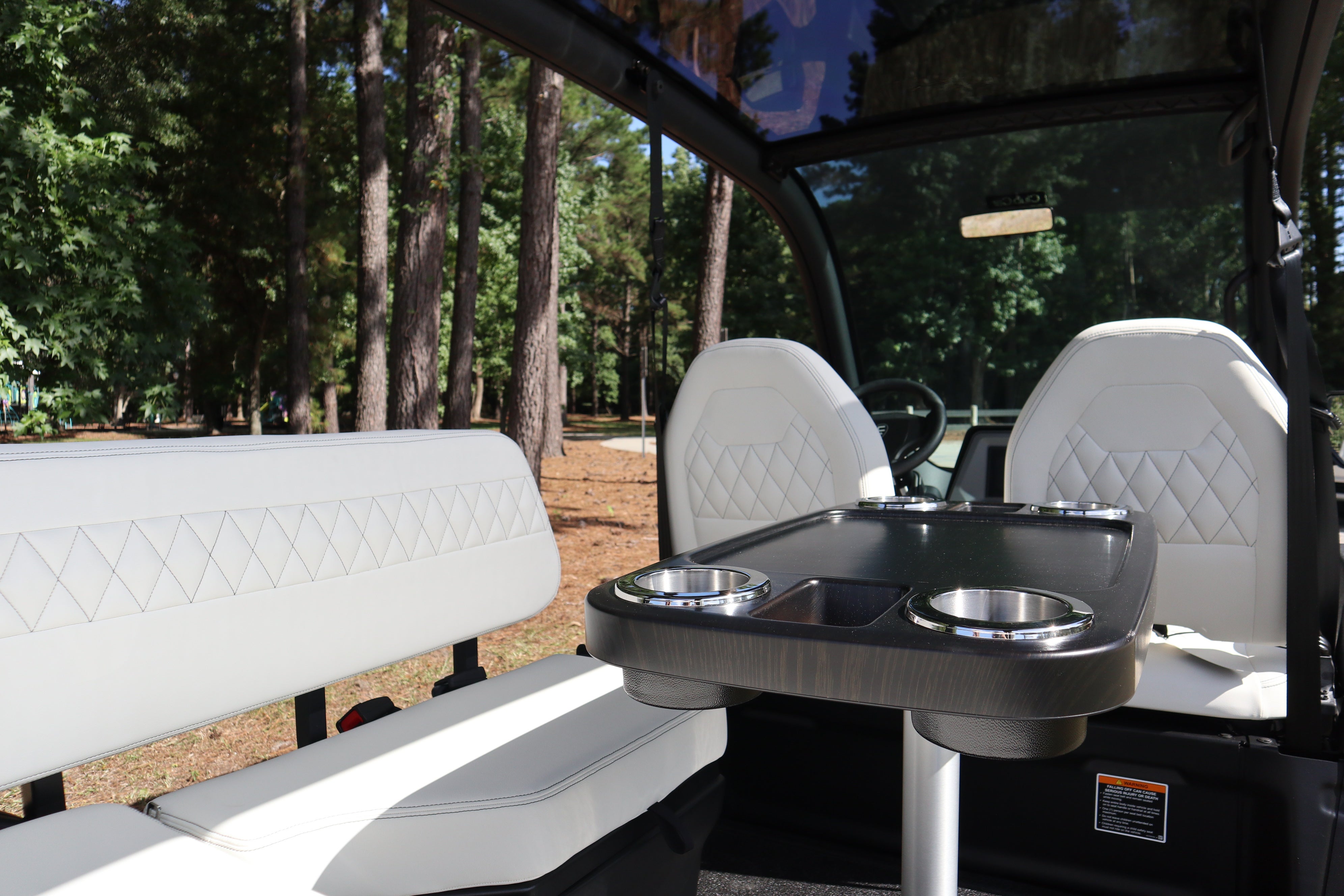 The interior table and seats of a Club Car CRU