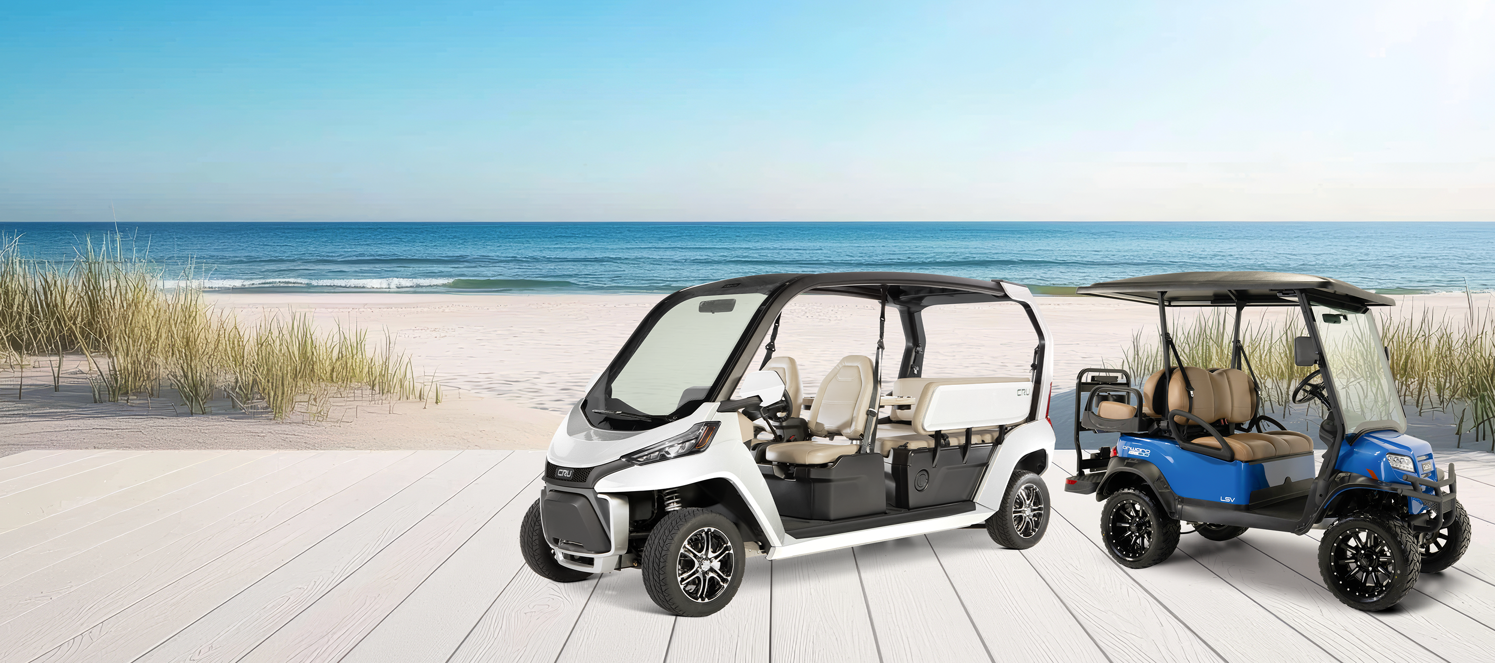A Club Car CRU and Onward vehicle sit side by side on a dock near the beach.
