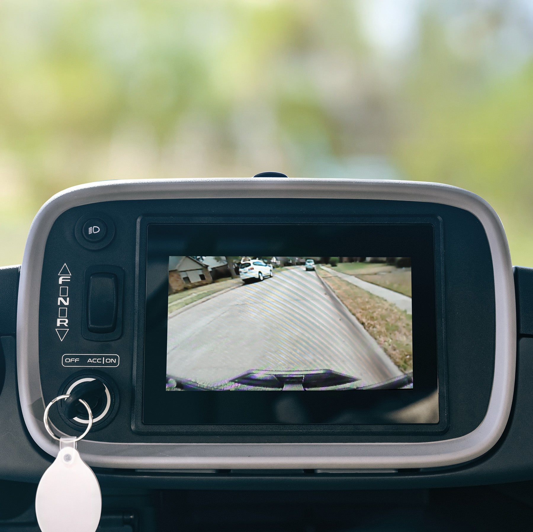 A backup camera's view of a neighborhood street