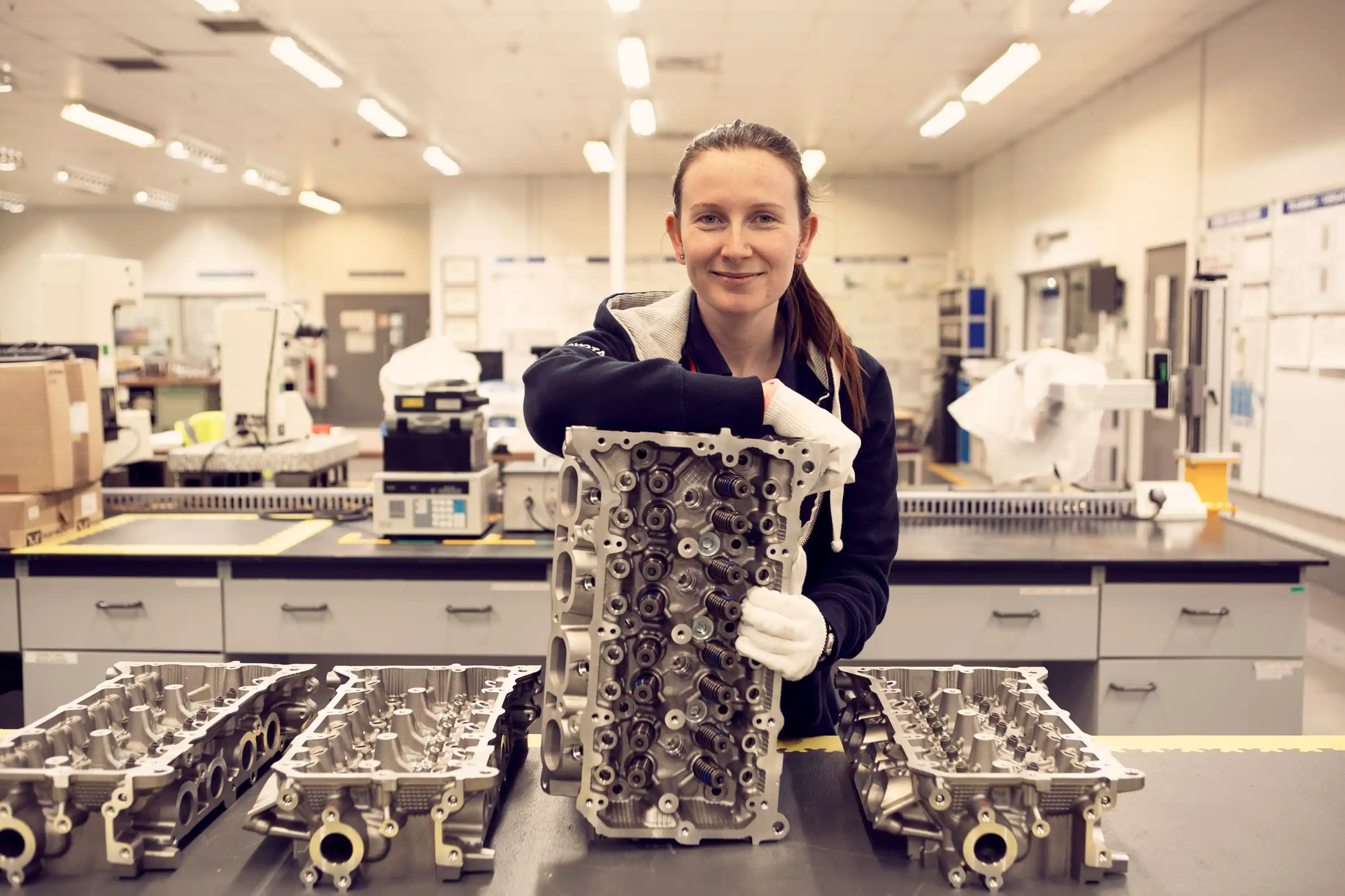 Engineer showcasing manufactured parts
