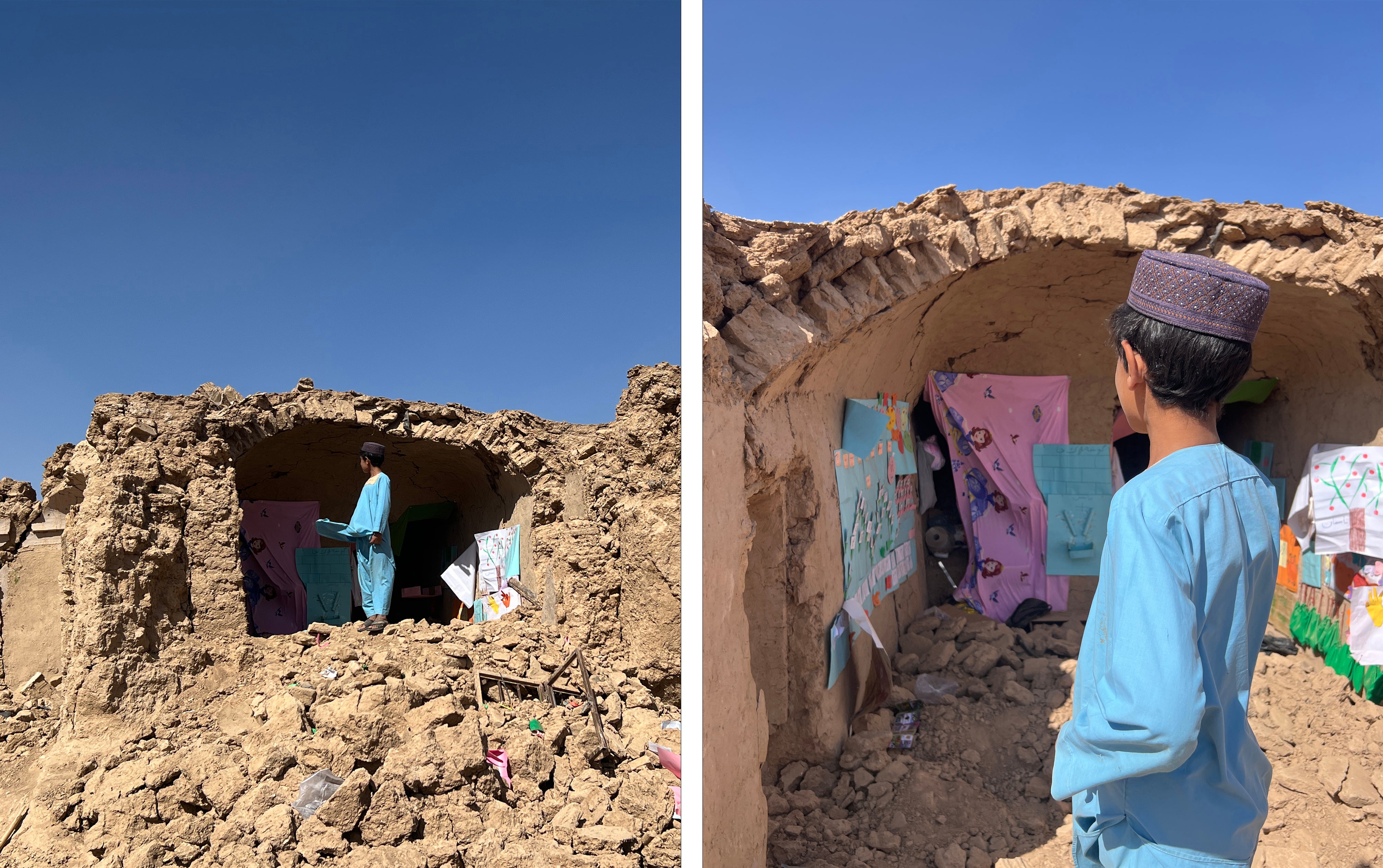 A young boy stands amongst the rubble of one of our early childhood education space. Some of the children's paintings and visual learning charts remain, but the classroom is destroyed.