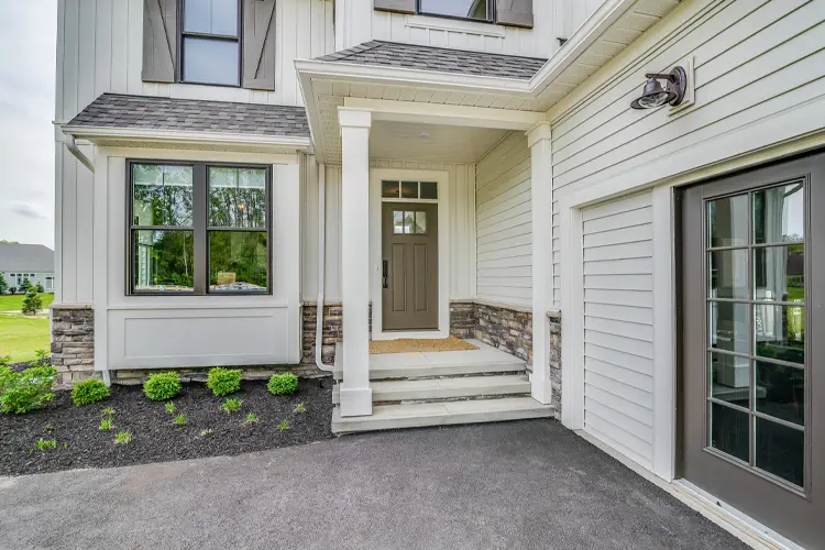 Why Are Home Insurance Rates Increasing in NJ? Gorgeous front porch entry connected to driveway.