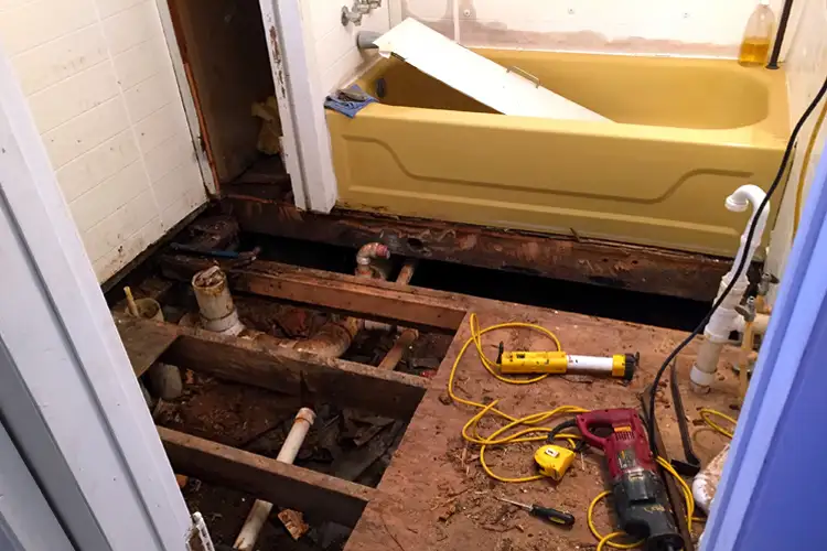 Gutted bathroom after sewage line bust. If Your Home's Sewage Line Busts, Who's Responsible?