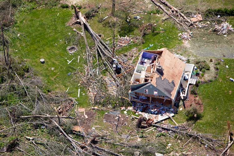 An aerial view of the destruction done to a single family home by a tornado. Don't Miss Out On These Life or Death Kentucky Tornado Coverages. 