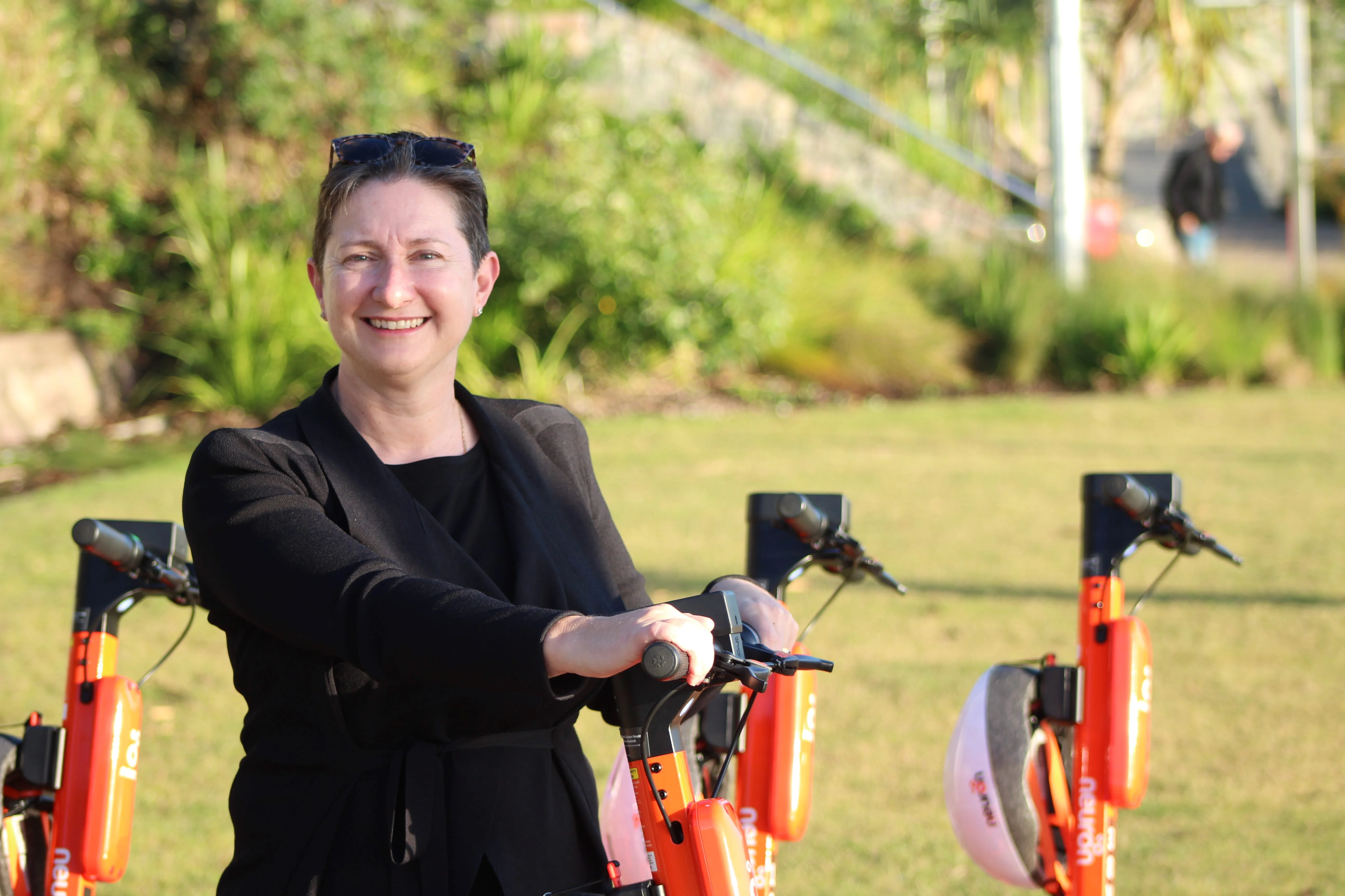 Sunshine Coast Council CEO Emma Thomas one of the first to try the e-scooter.
