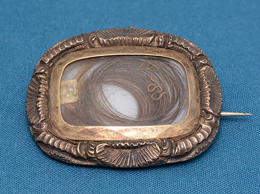 This mourning brooch was worn by Mary Grigor, and contains a lock of hair from a departed loved one. This brooch was passed down through the generations, first to Clementina and then Mary Ferris.