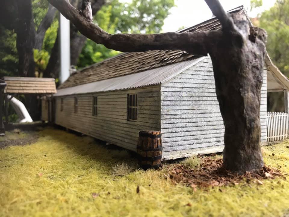 Intricate details were added – like individual shingles on the roof and a reconstruction of a heavily cut back tree beside the house. Timmy’s Miniature & Weathering Works.