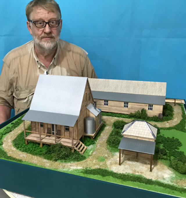Peter Sands with his completed model, 2018. Purple Cow Architectural Imagery.