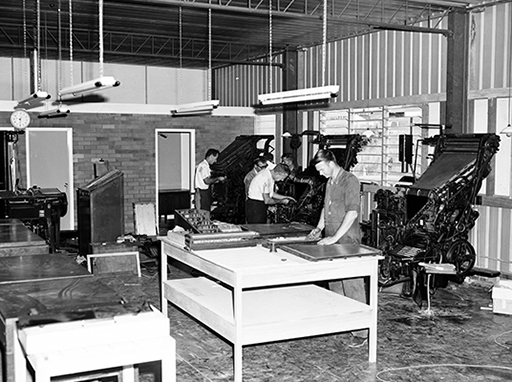 Installing printing machinery in the newly constructed Chronicle building, Price Street, Nambour, 1966. At the time the Chronicle had a staff of twenty-seven and sold over six thousand copies of the paper each week.