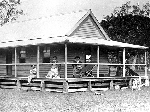 Members of the Tripcony family pictured on the verandah of their first home ‘Cowie Bank’, on Pumicestone Passage in 1892.