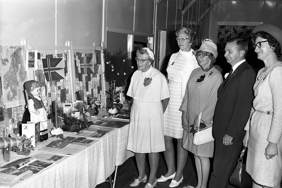 Group of official guests admiring a display at the Nambour C.W.A. Branch’s International Day, held in the Q.C.W.A. Rest Rooms, Nambour, July 1971 - The theme of the display was Norway, the country chosen by the Q.C.W.A. for study in 1971. (Picture Sunshine Coast)