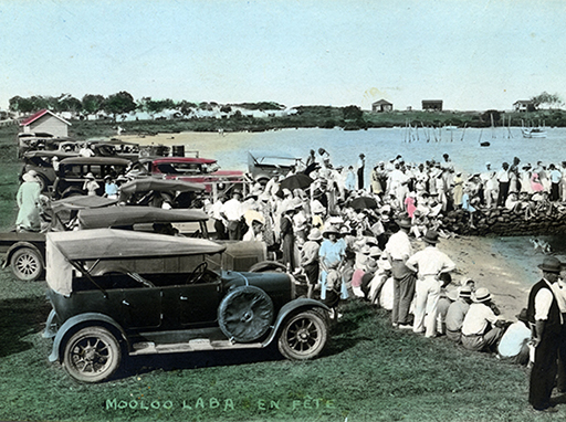 Crowds on the Mooloolah River bank and public jetty opposite River Esplanade, Mooloolaba, December 1934.