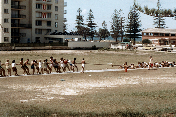 Teams participating in a 'tug-o-war' competition on the sports ground at Alexandra Park, Alexandra Headland, ca 1983.