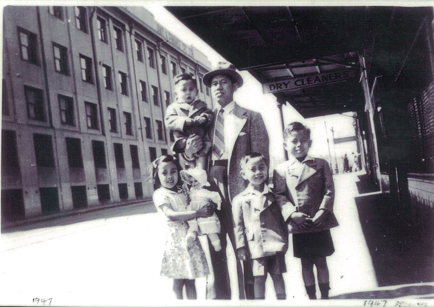 King Fong with his father and siblings outisde their fish and chip ship in Ultimo (1947)