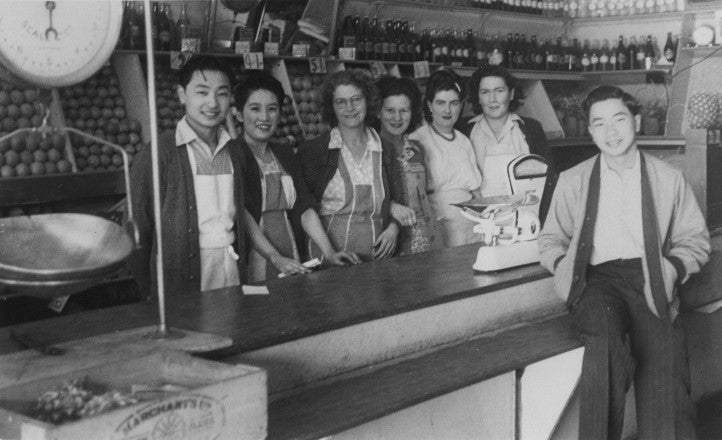 Stanley Hunt (1st from left), his brother (1st from right) and his employees at Auburn Fruit Shop (1951)