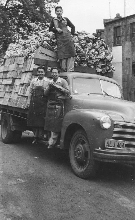 Stanley, his brother Desmond and cousin Alan Wong with truckload of produce for their fruit shops