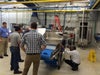 Group examining conveyor belt
