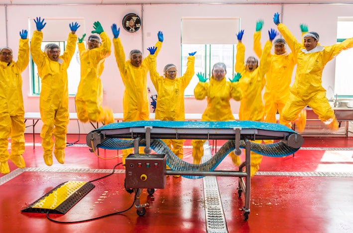 Jumping training participants in PPE at Sanitation Essentials Training