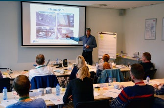 Man teaching in front of classroom