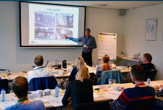 Man teaching in front of classroom