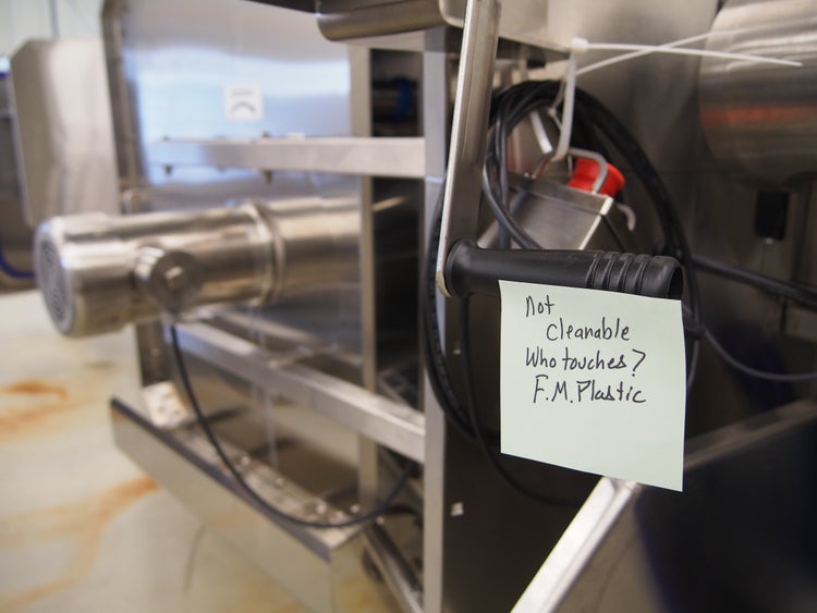 A note on an equipment handle calling out food safety risks related to hygienic design.
