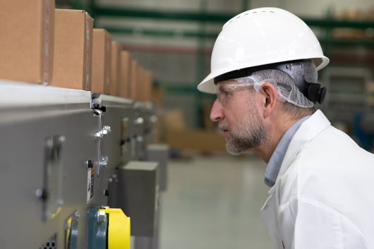 Man watching conveyor close up
