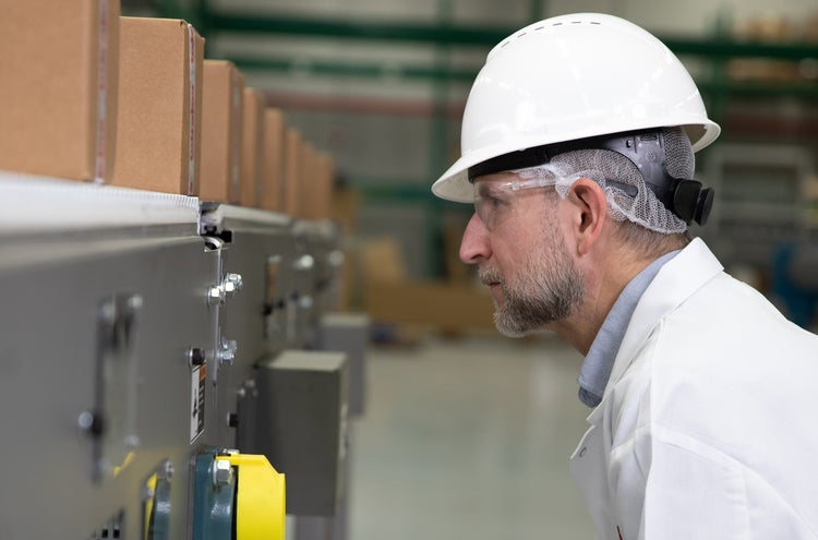 Man watching conveyor close up