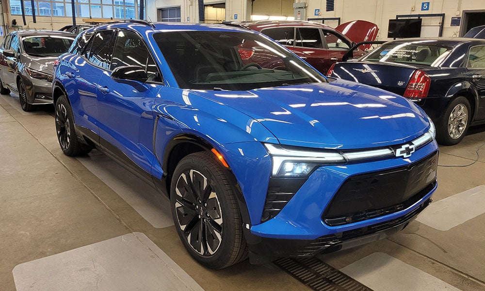 A blue suv parked in a building