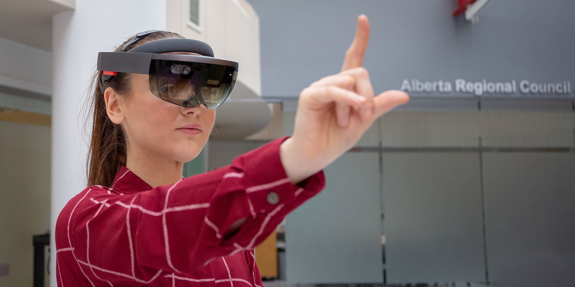 A woman wearing virtual reality goggles A woman wearing virtual reality goggles
